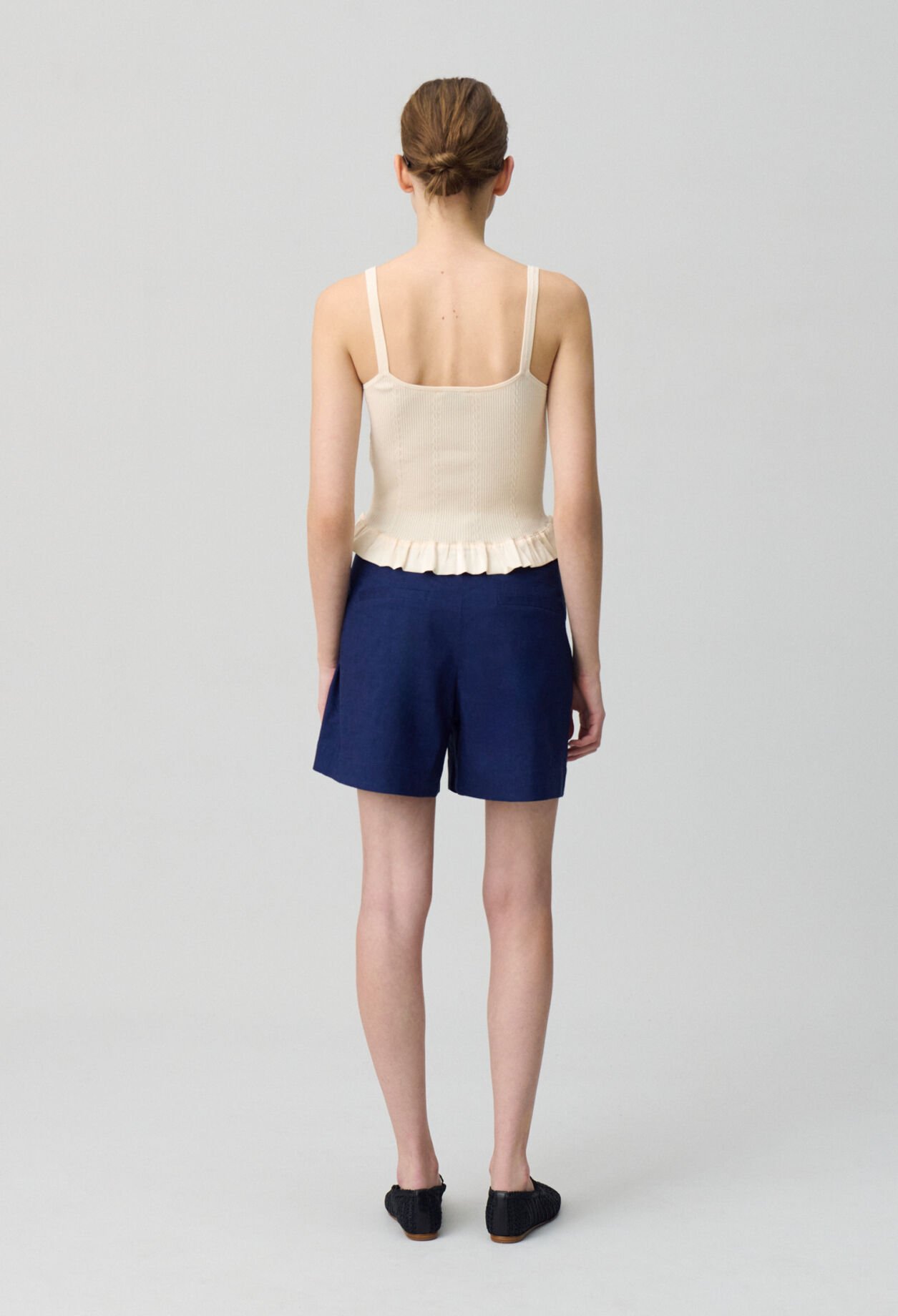 Top satinado con volantes
