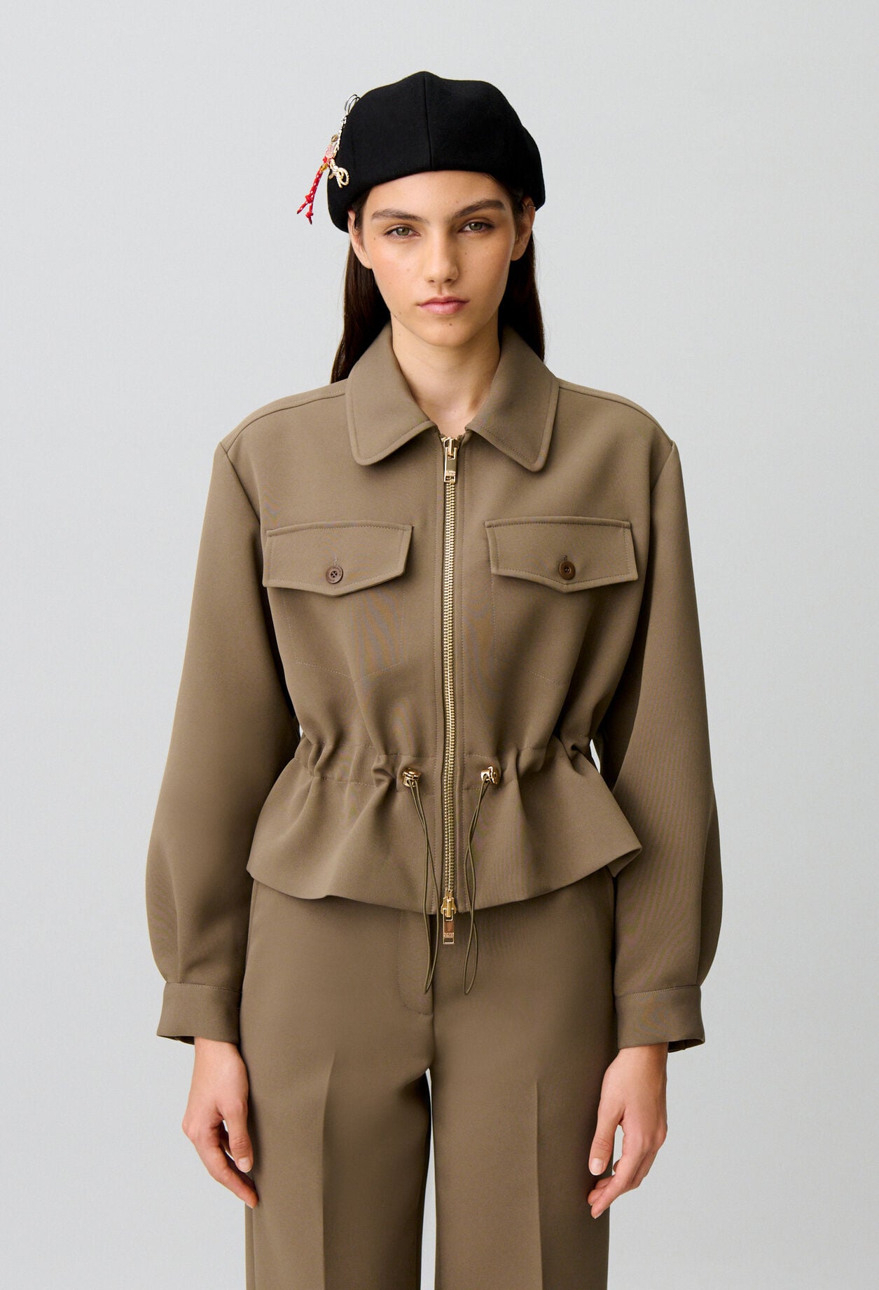 Chaqueta peplum flor dorada