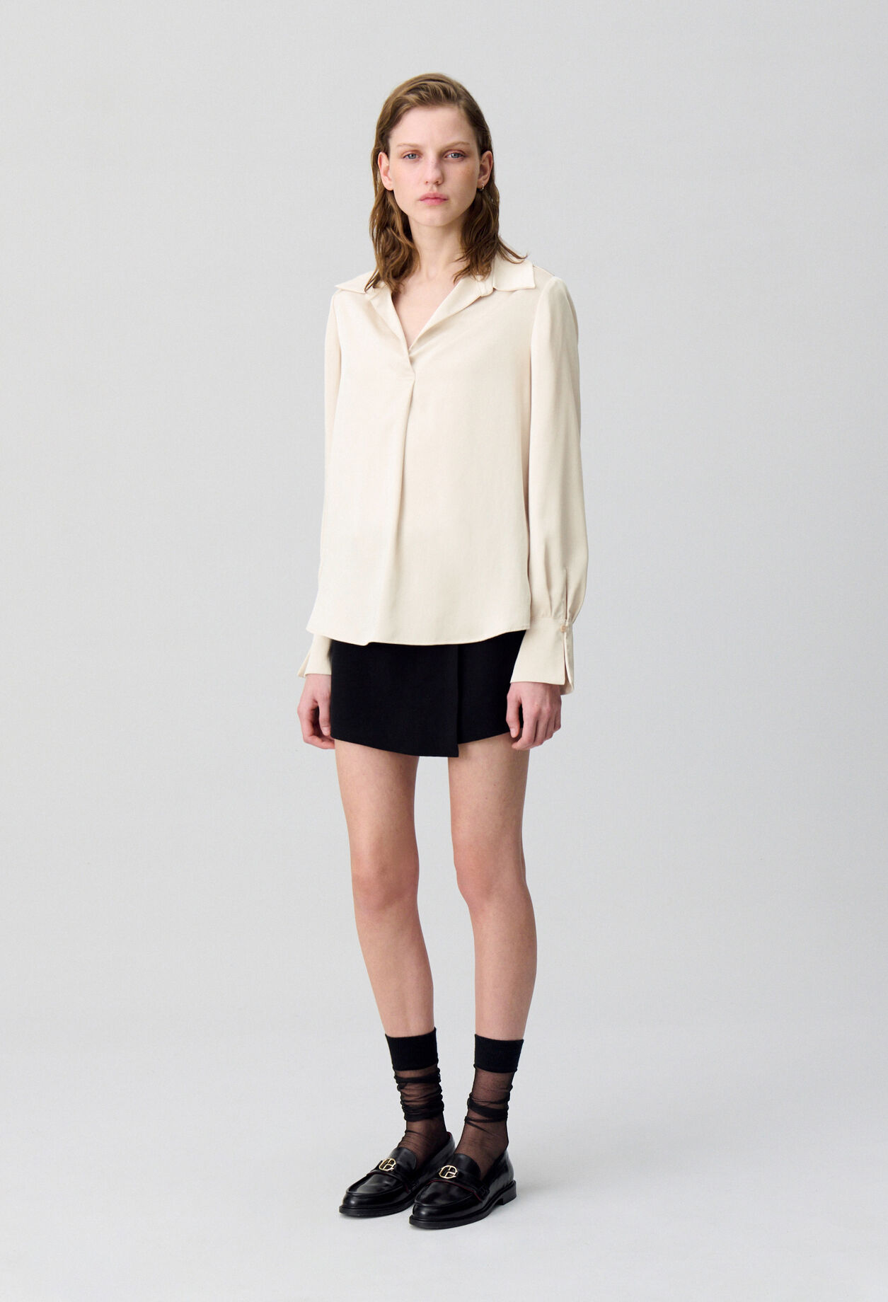 Blusa fluida plisada