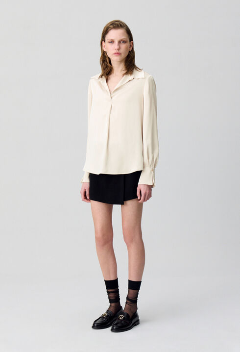 Blusa fluida plisada