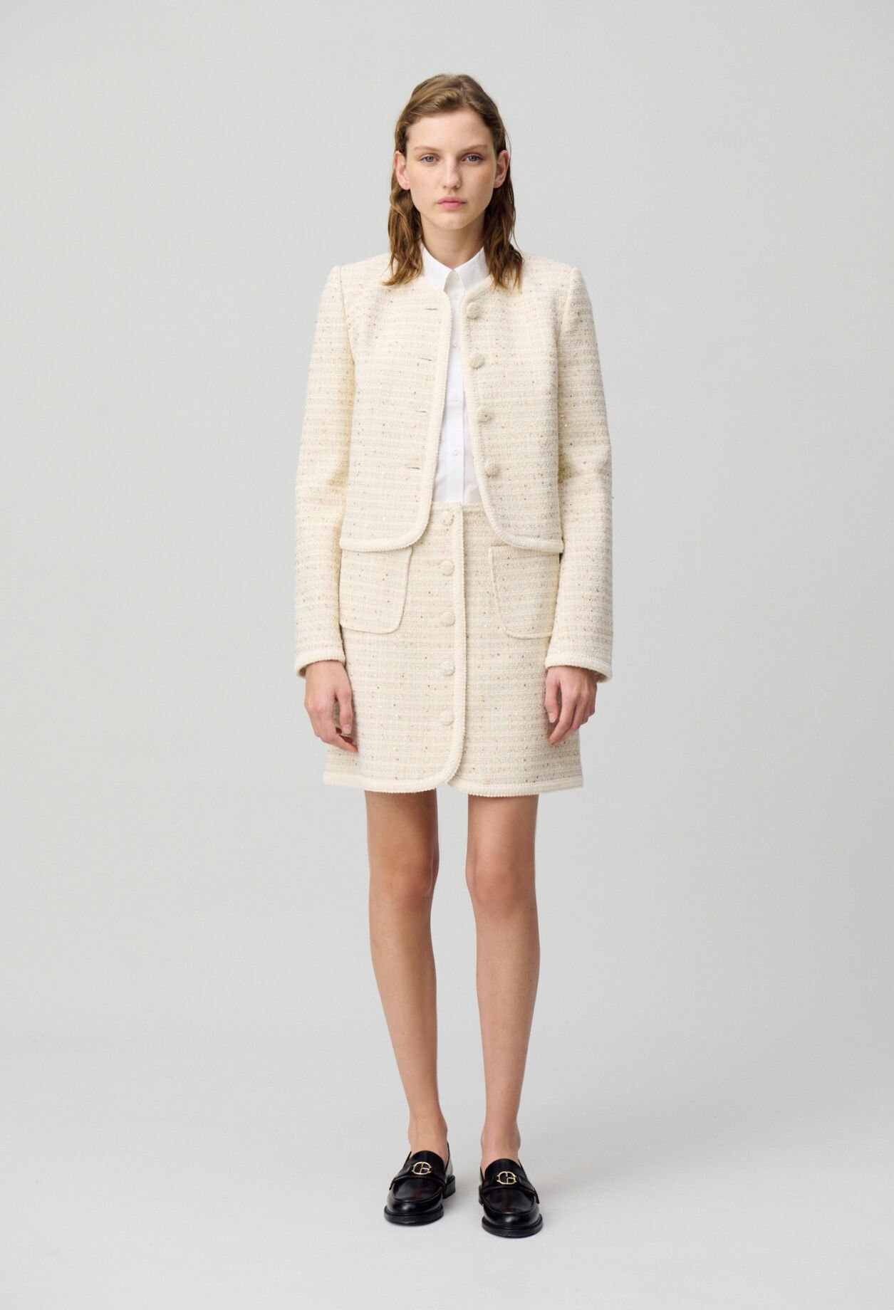 Falda corta de tweed con botones