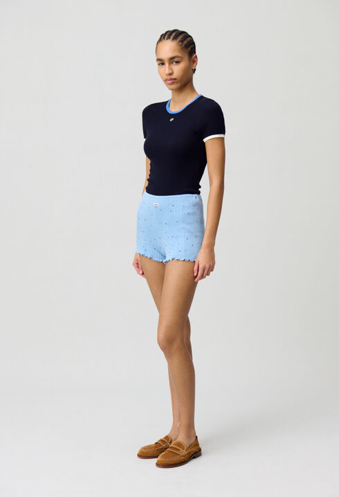 Short de punto fino.