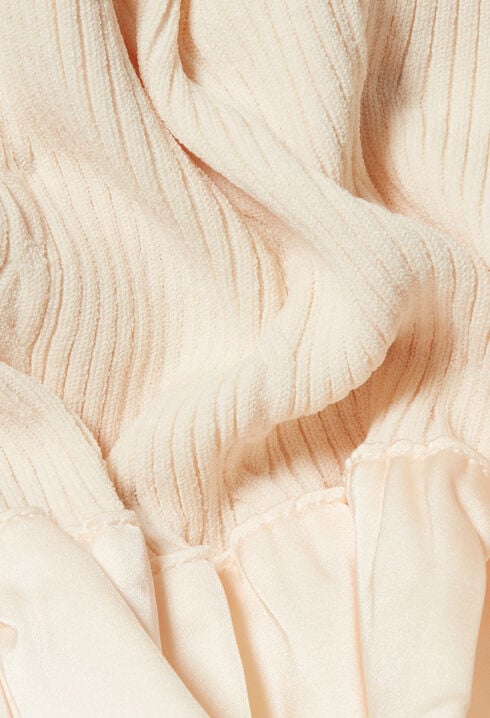 Top satinado con volantes