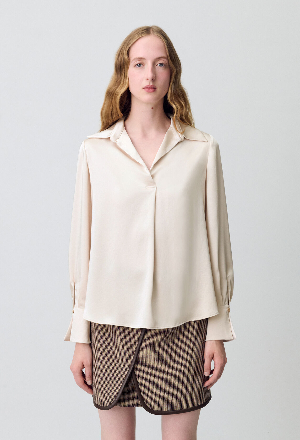 Blusa fluida plisada