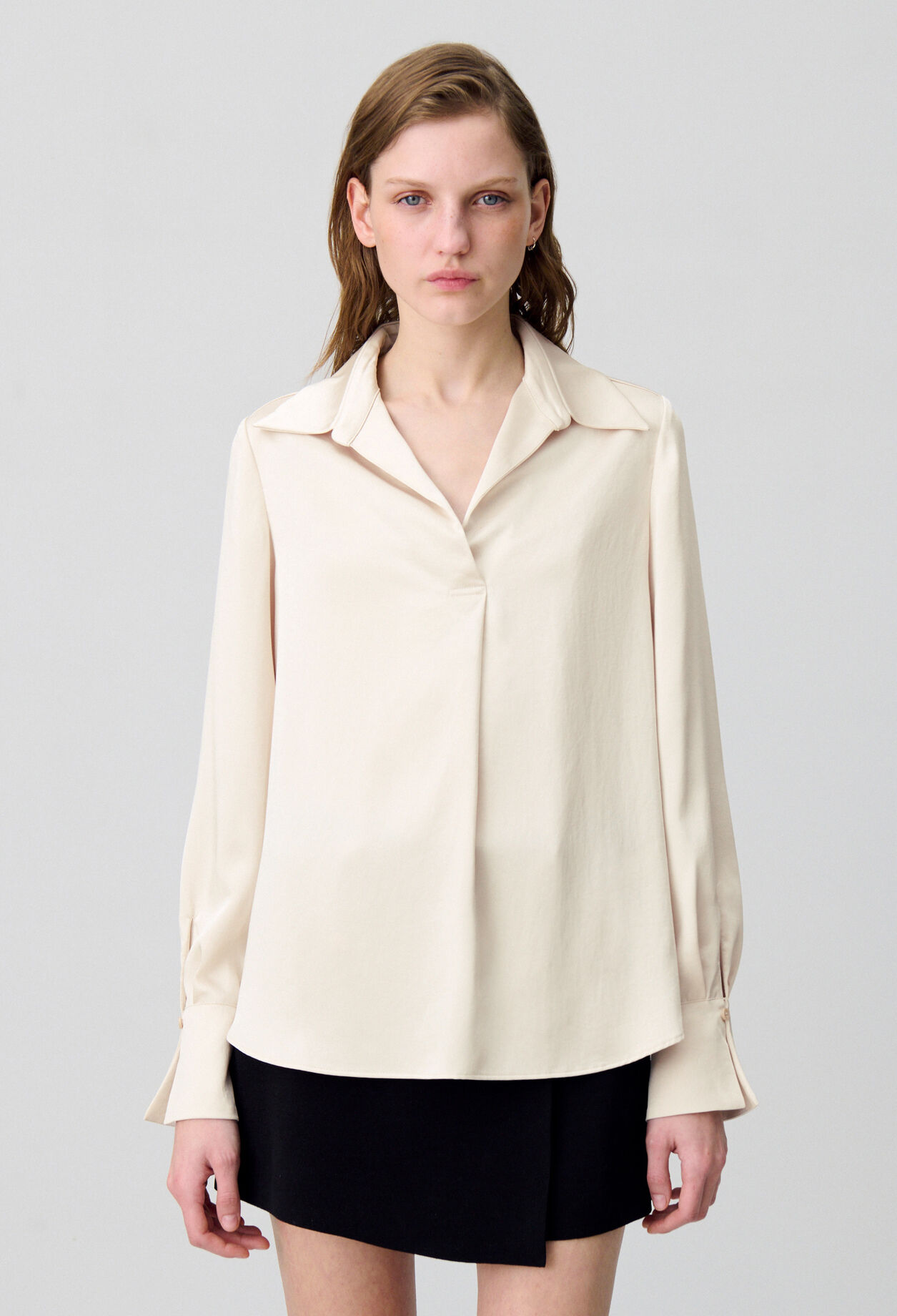 Blusa fluida plisada