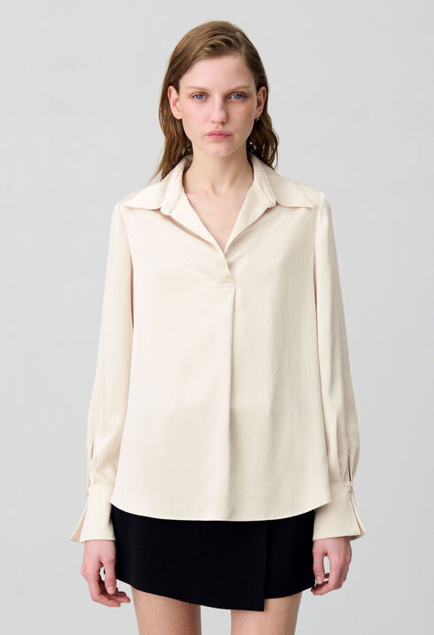 Blusa fluida plisada