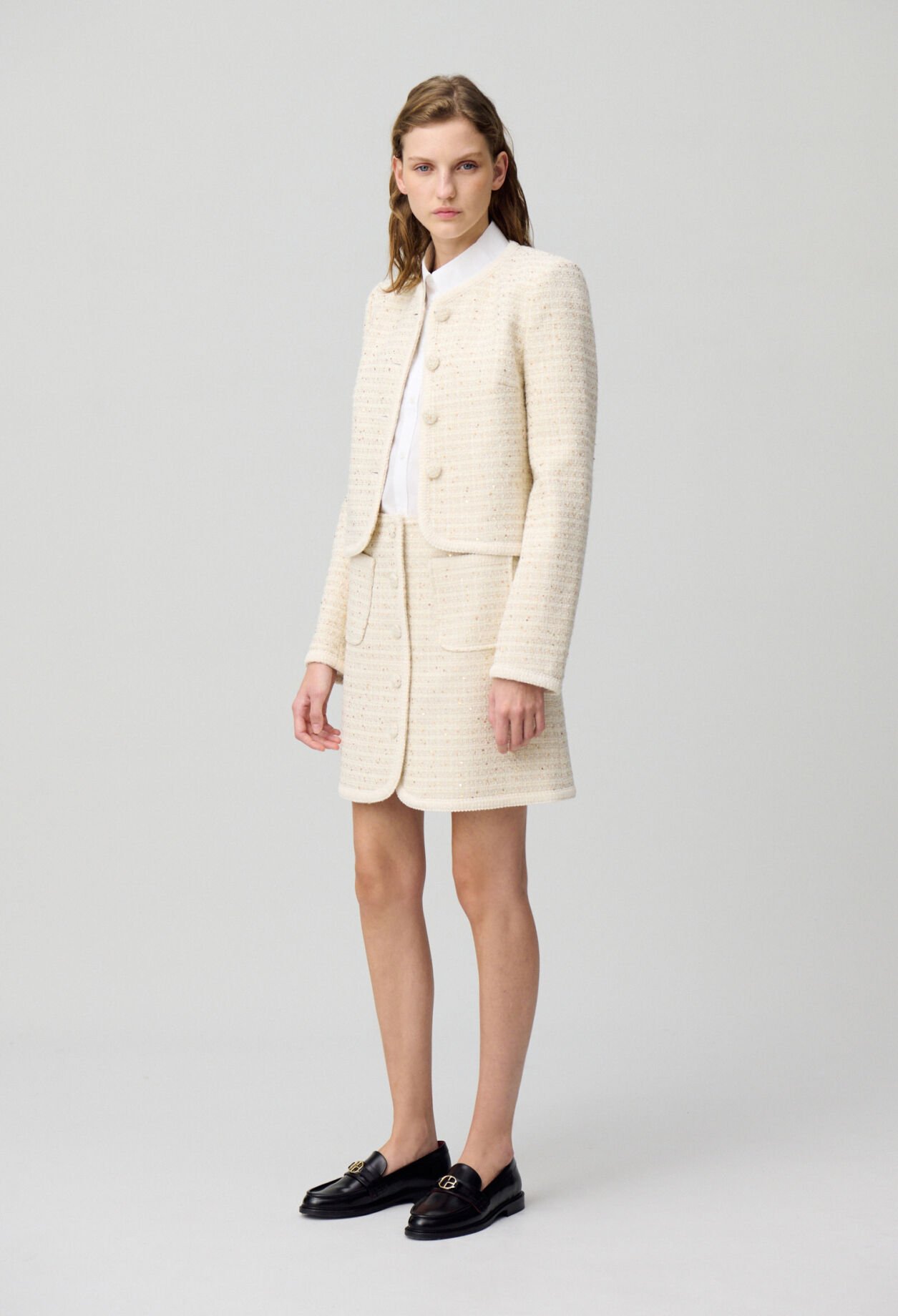 Falda corta de tweed con botones