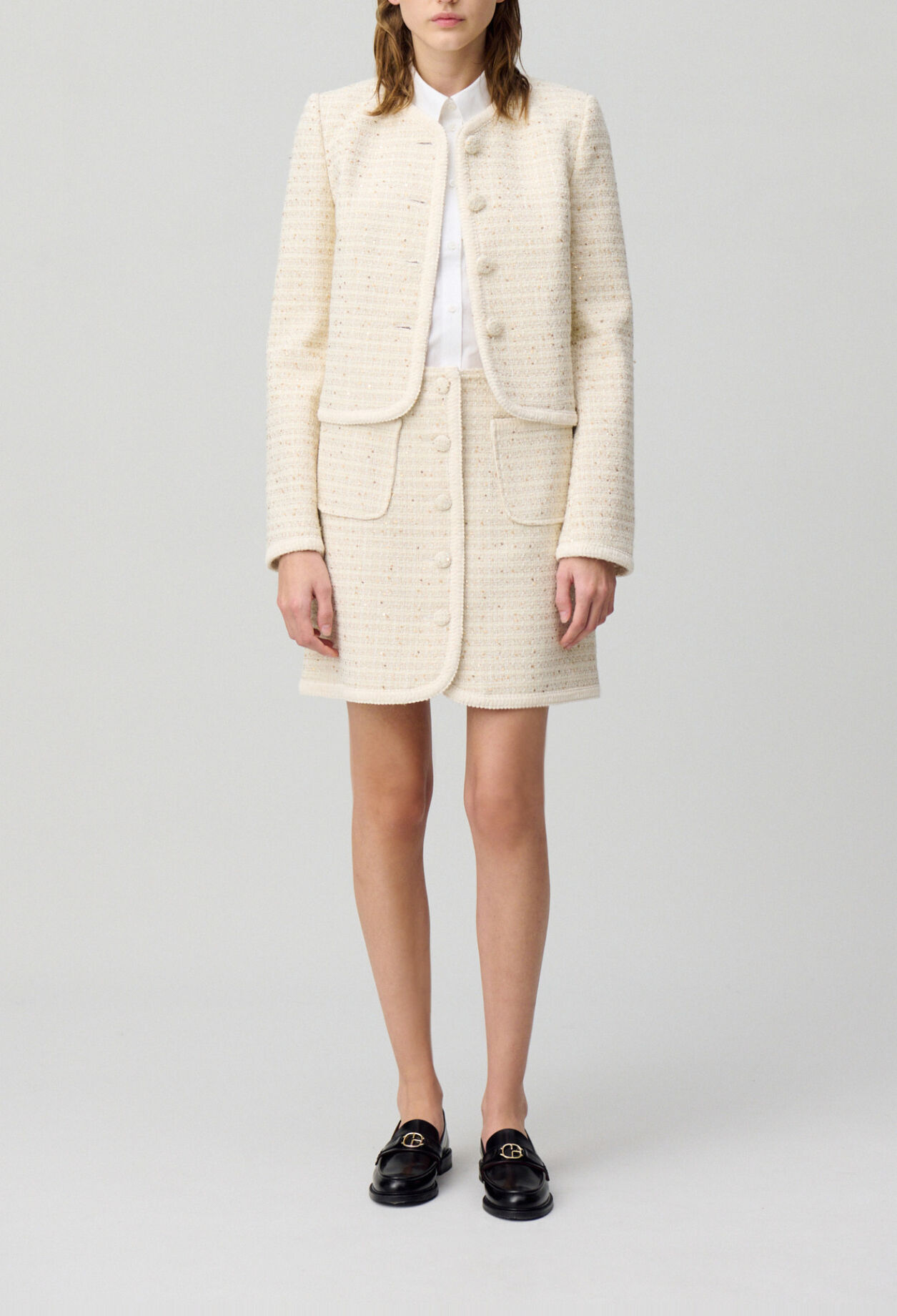 Falda corta de tweed con botones