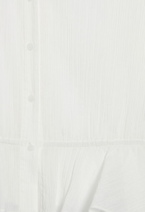 Camisa con bajo de volantes en crudo