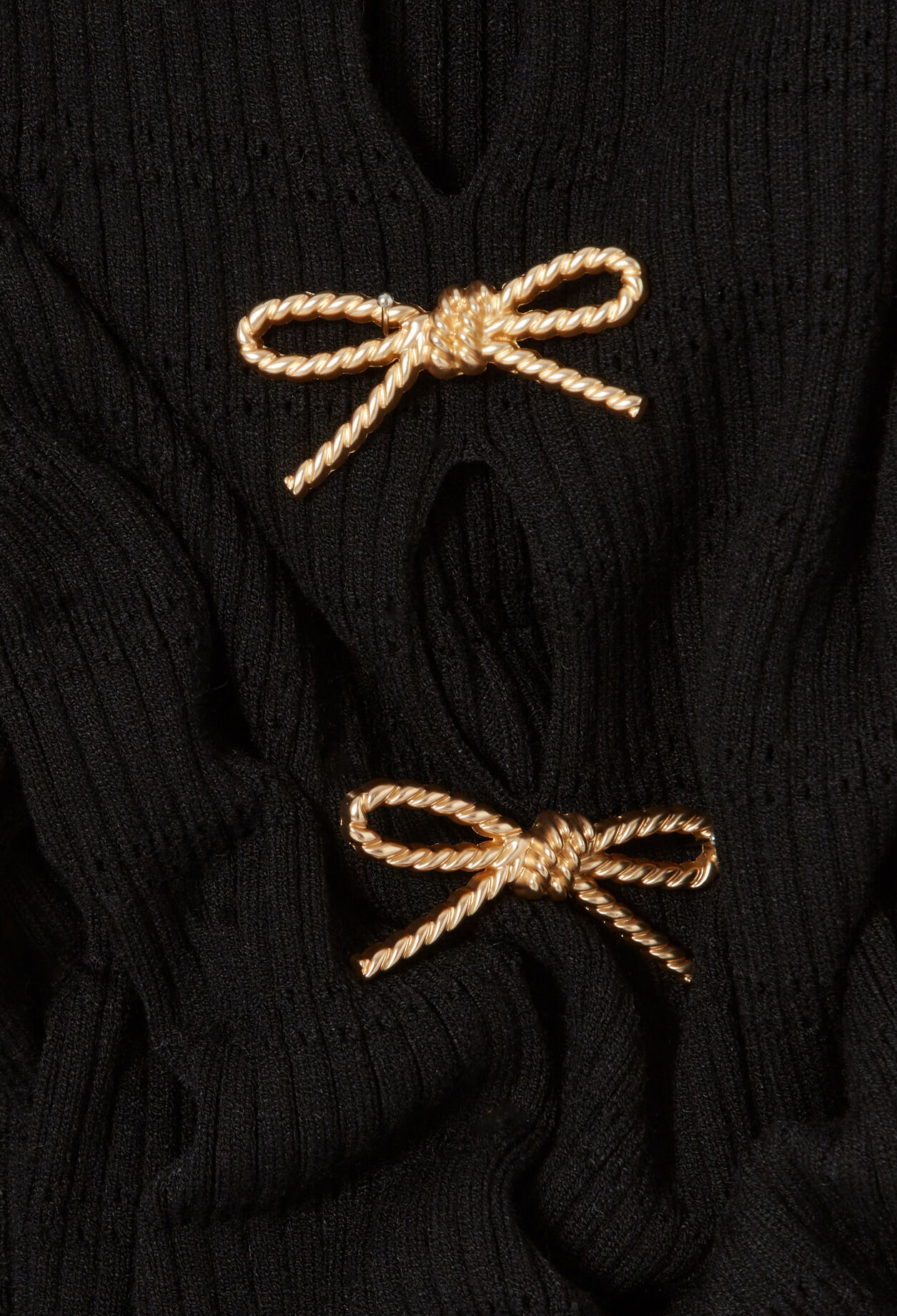 Vestido corto de punto con nudos