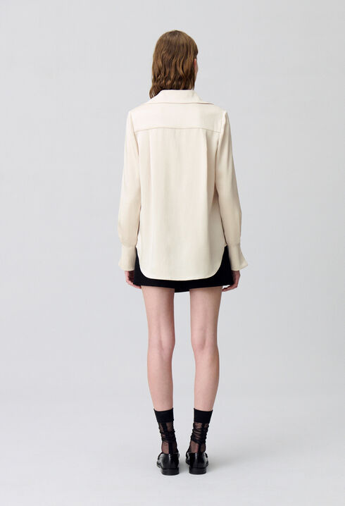 Blusa fluida plisada