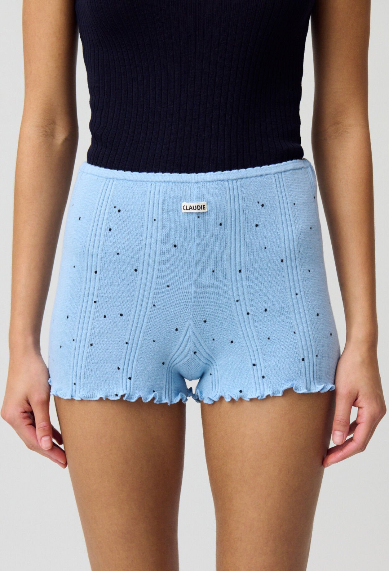 Short de punto fino.