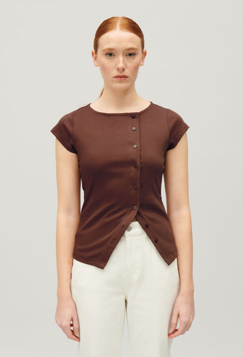 Top asimétrico abotonado en negro