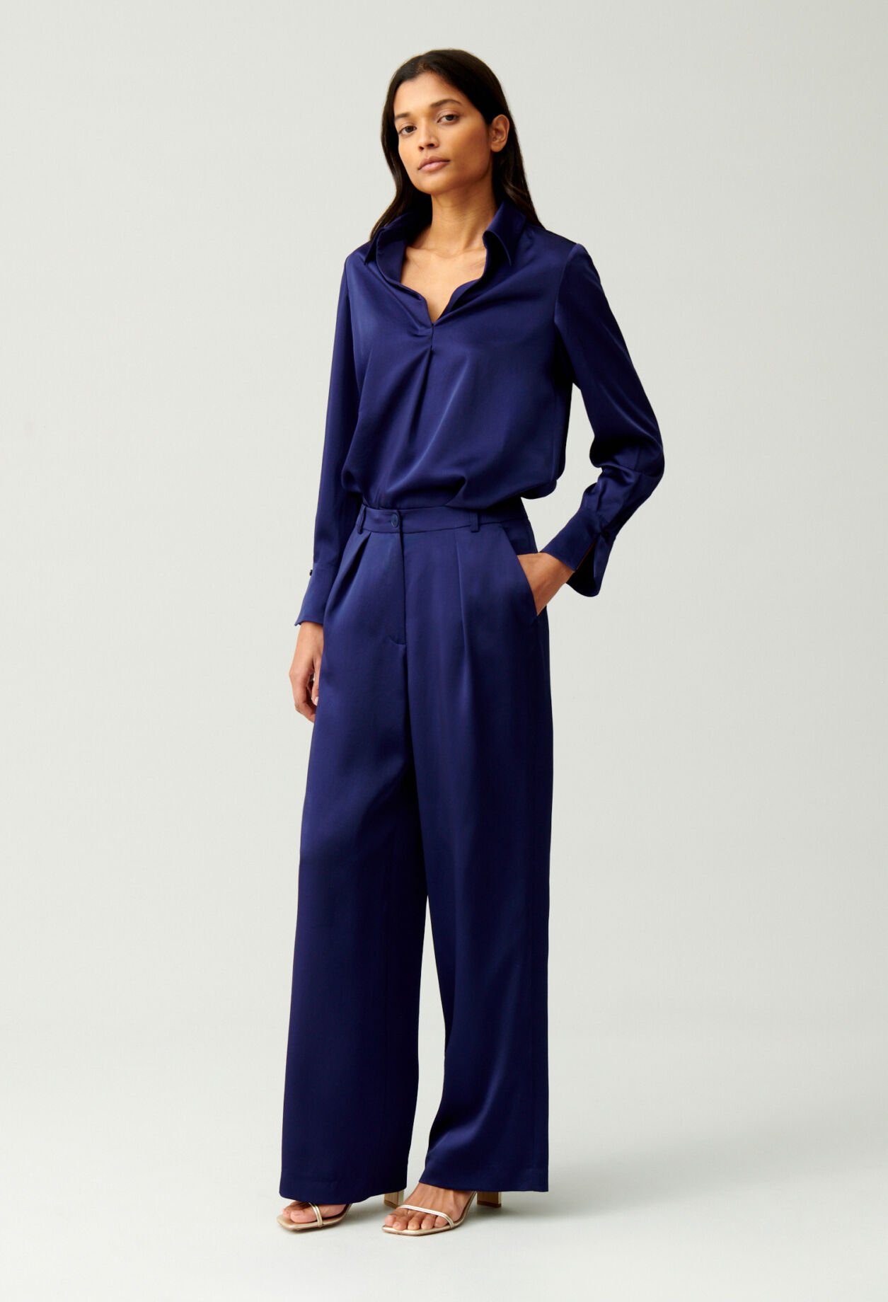 Blusa fluida plisada