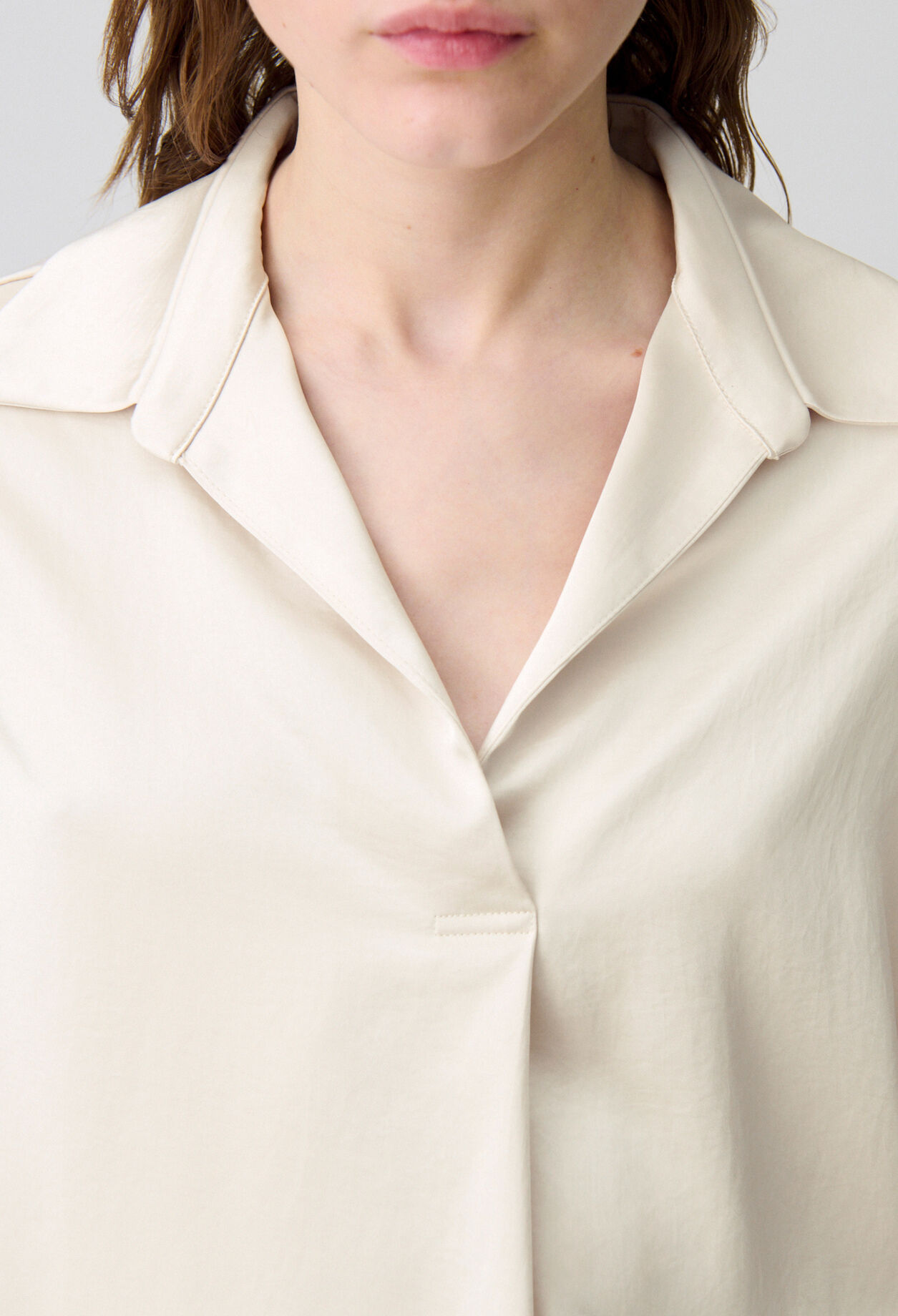 Blusa fluida plisada