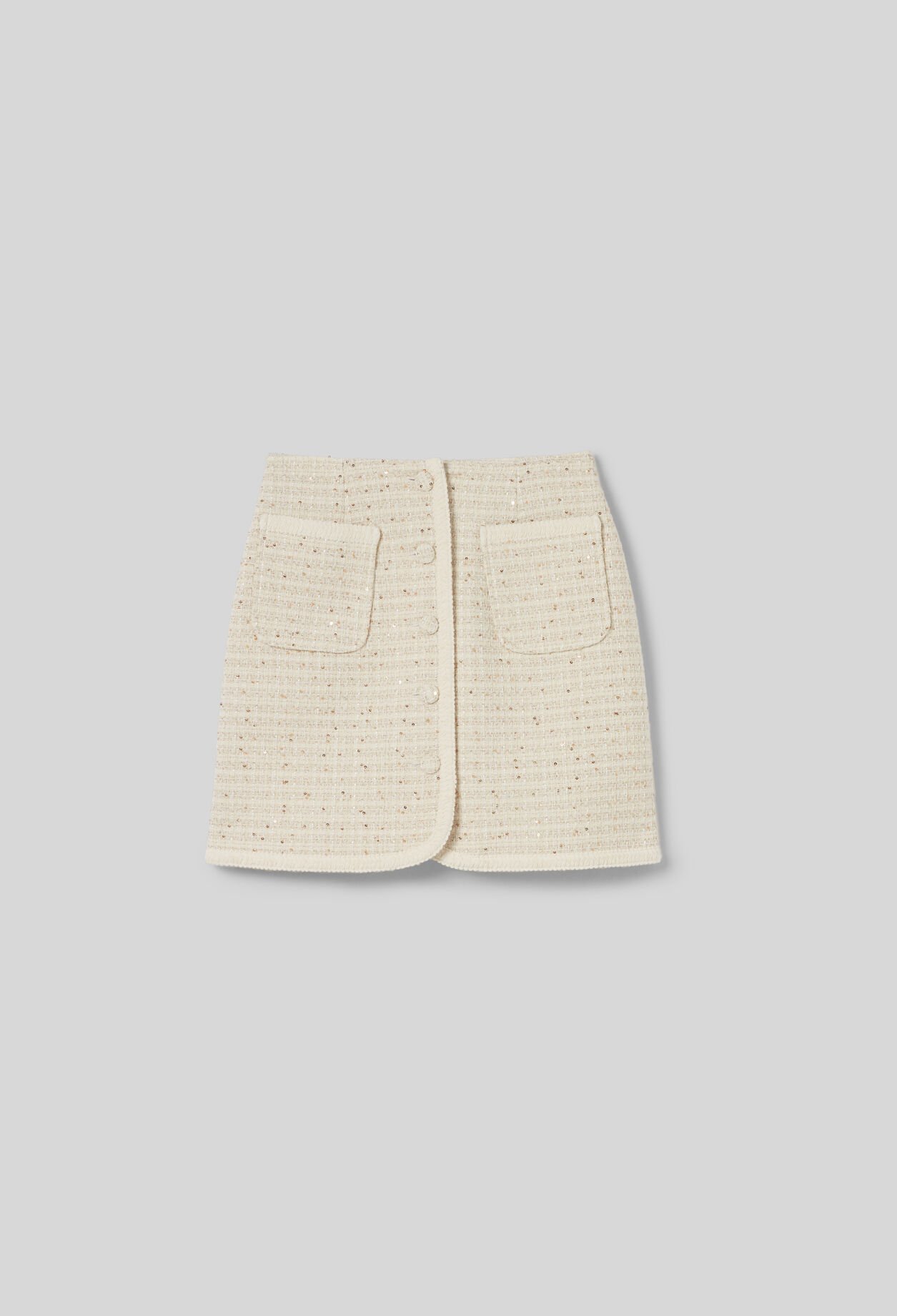 Falda corta de tweed con botones
